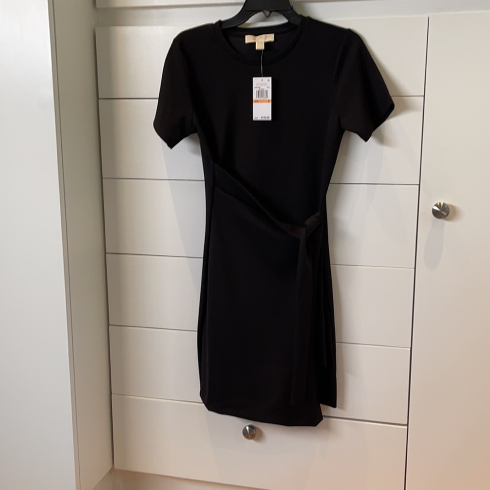 Black short-sleeves, side tie wrap around waist dress never worn. Tags still on